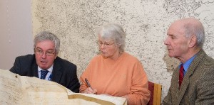 From the left, Keith Sweetmore explains to Gill Woodhead and John Lund the meaning of the parchments.