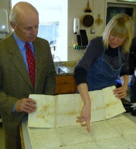 John Lund (left) has further damage pointed out by Rachel Greenwood, Conservator.